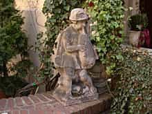 Stein-Gartenfigur eines Dudelsackspielers
