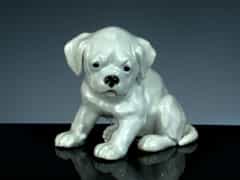 Kleiner Porzellanhund, Marke Heubach-Kunstporzellan. H.: 12 cm.