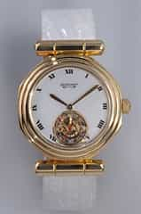 GERALD GENTA HERRENARMBANDUHR 18 KT GELBGOLD MIT TOURBILLON 