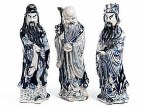 Drei Porzellanfiguren buddhistischer Schutzheiliger