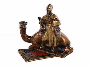 Bronzegruppe eines arabischen Teppichverkäufers