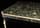 Detailabbildung: Schwarze Lackkommode um 1800 mit grüner Marmorplatte